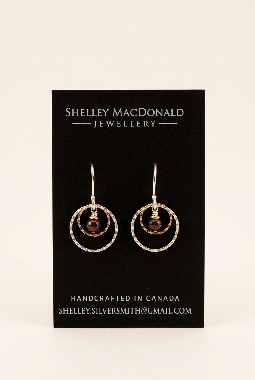 Crimped Round Dangle Garnet Earrings with a cleaner background