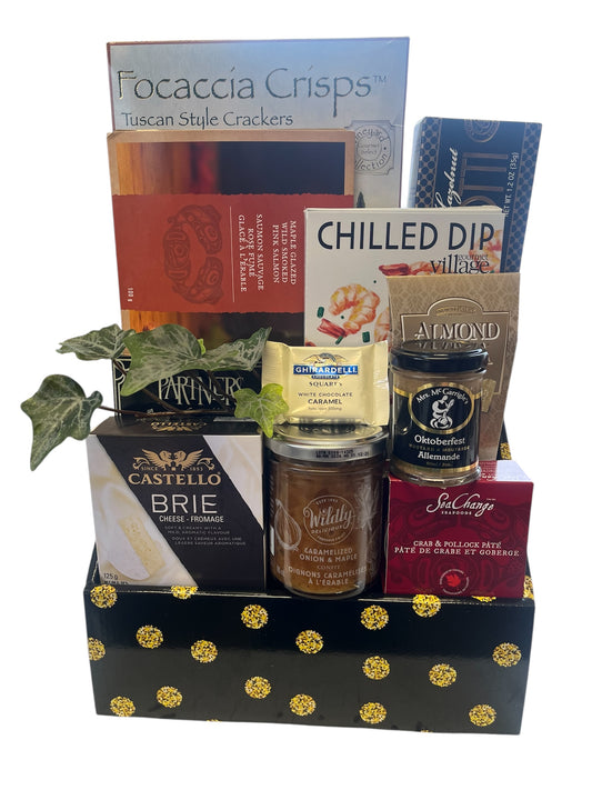 Assorted food items including crackers, cheese, and dips in a decorative box.